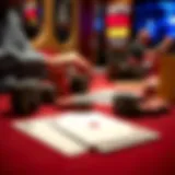 A close-up view of poker chips and cards laid out on a felt table.